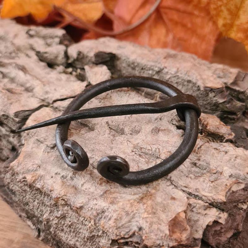 Iron fibula with coiled ends - handcrafted