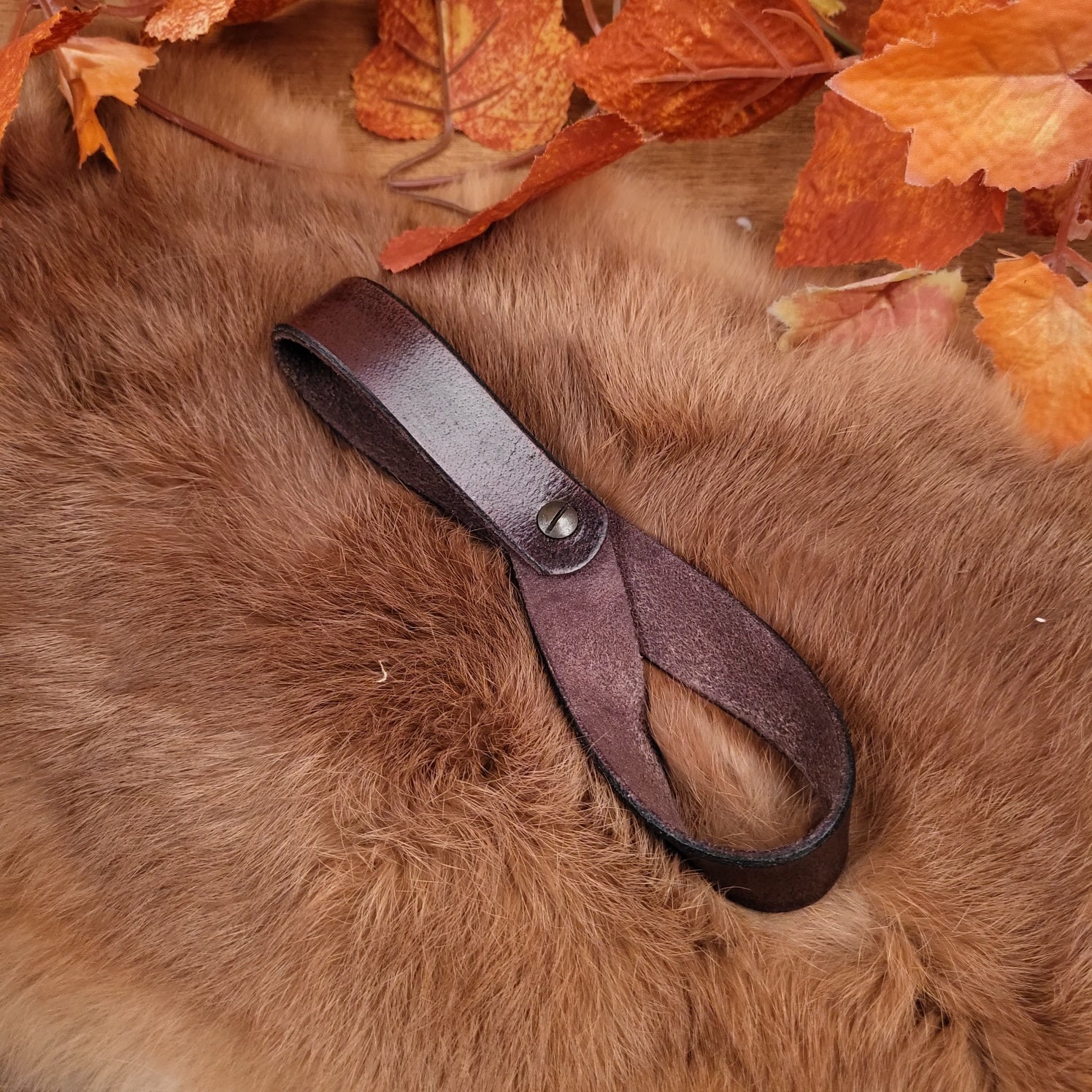 Belt holder for drinking horn made of buffalo leather