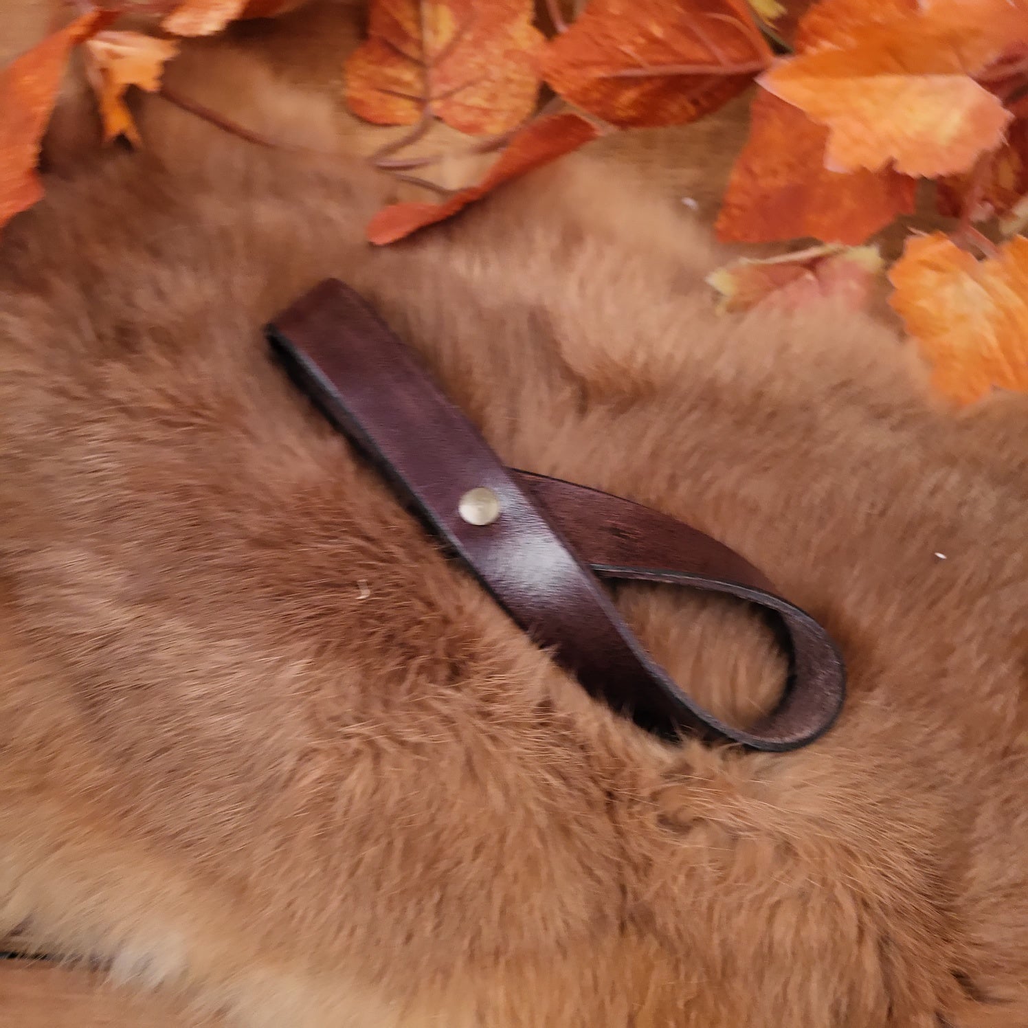 Belt holder for drinking horn made of buffalo leather