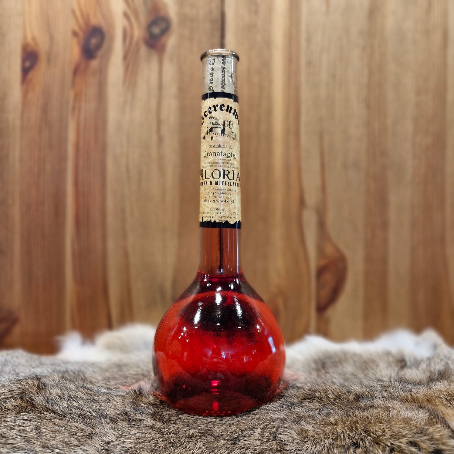 Granatapfelwein in Elixierflasche