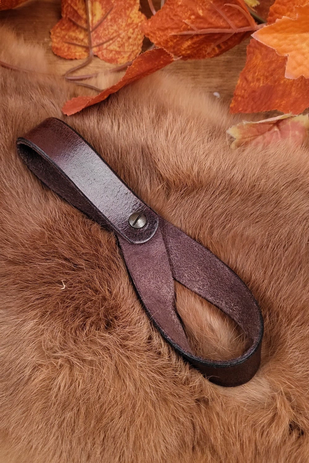 Belt holder for drinking horn made of buffalo leather