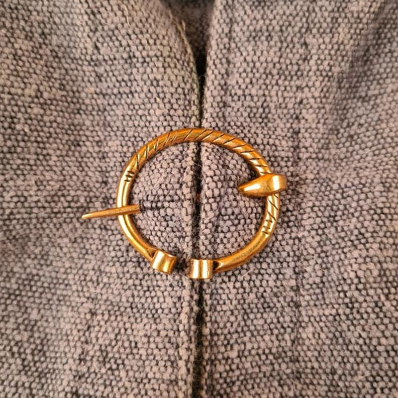 Small medieval bronze fibula