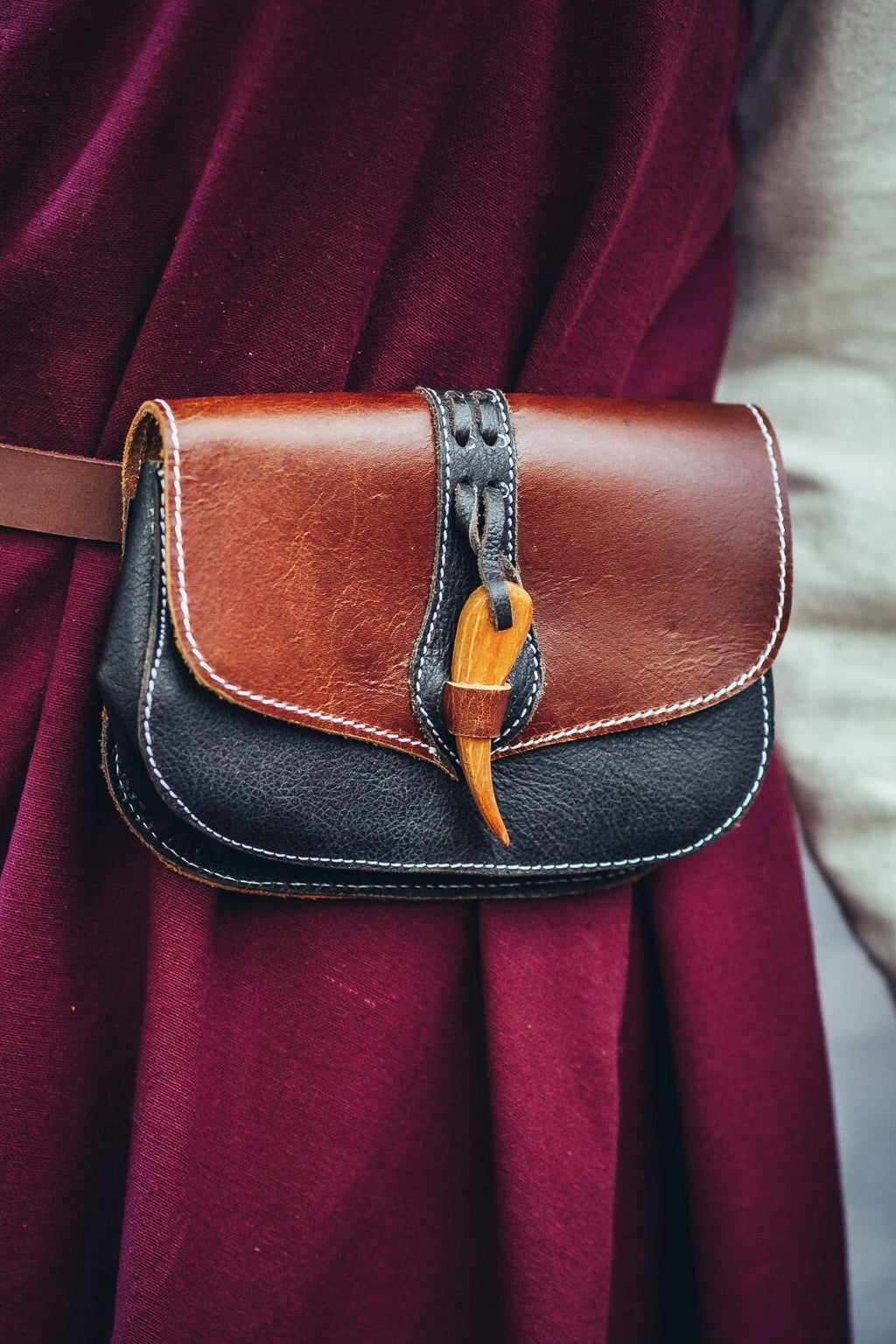 Leather belt bag with wood clasp