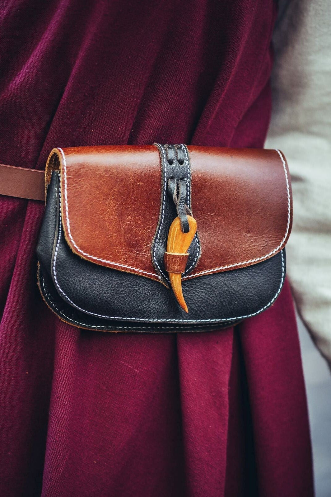 Leather belt bag with wood clasp