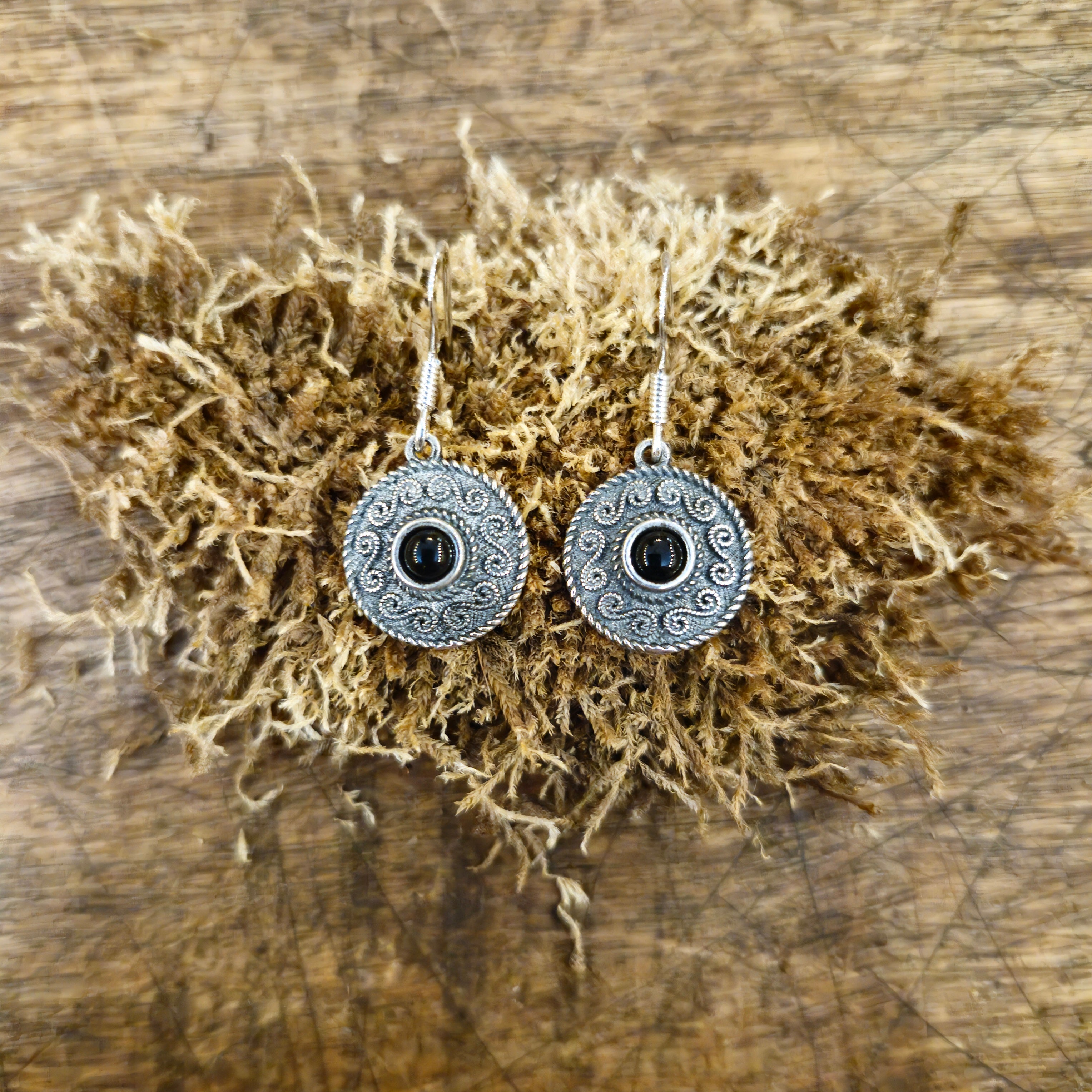 Silver dangle earrings with spiral pattern & gemstone