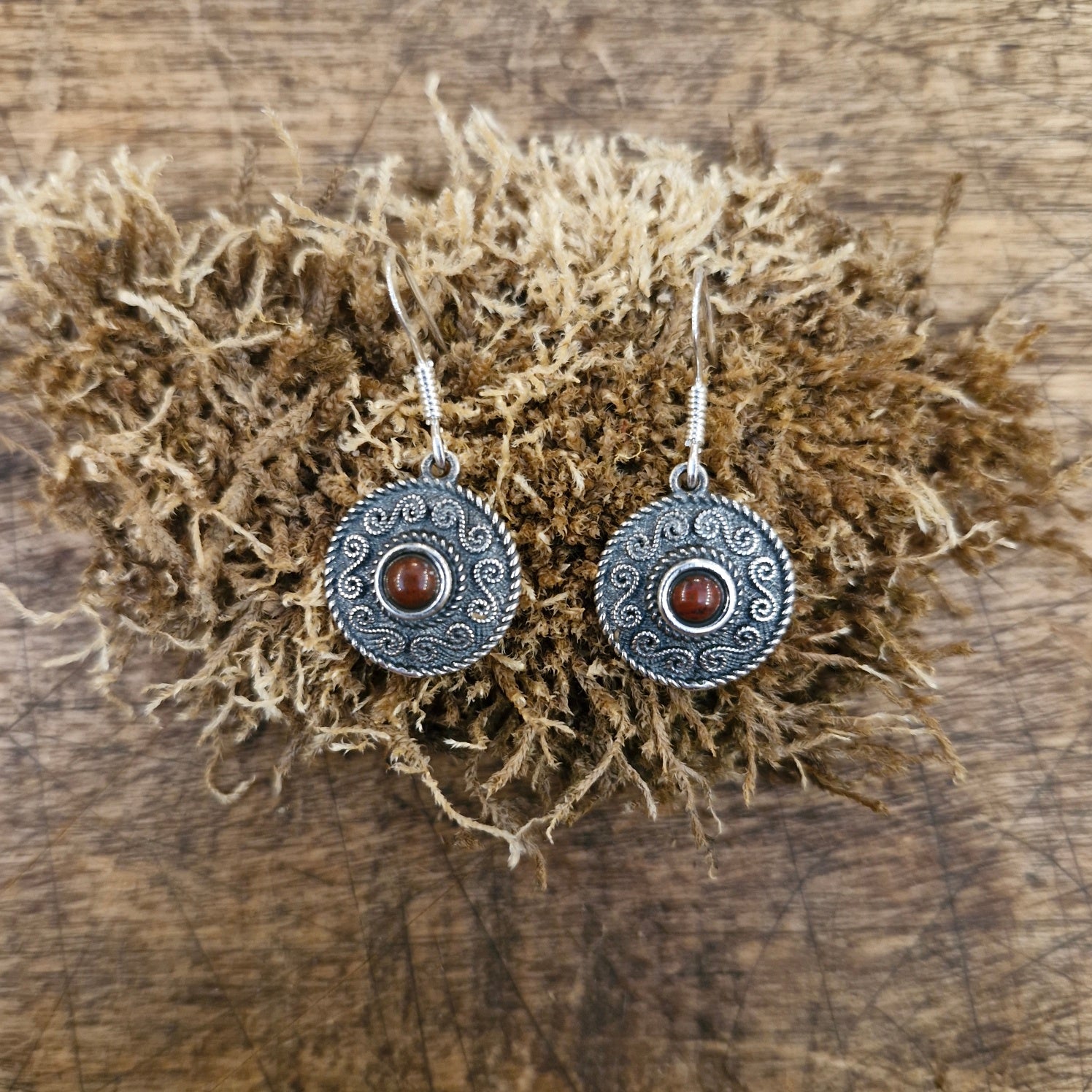 Silver dangle earrings with spiral pattern & gemstone
