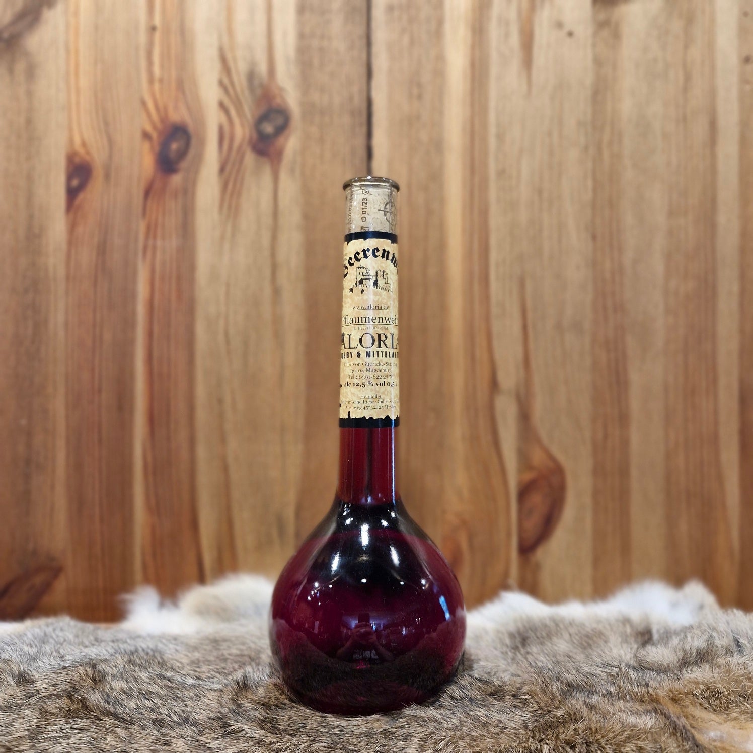 Pflaumenwein in Elixierflasche