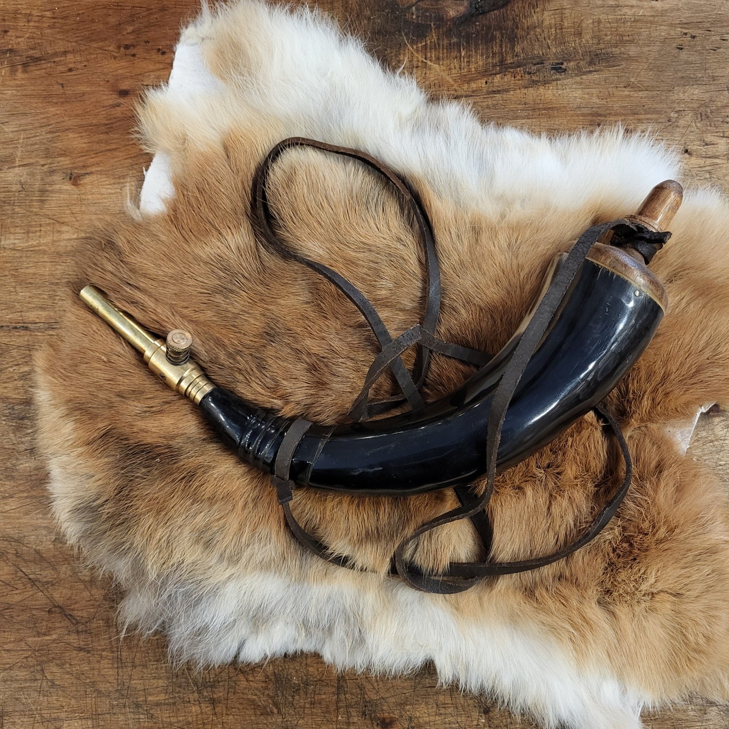 Powder horn with brass cock and leather strap - Replica