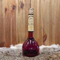 Sloe wine in elixir bottle