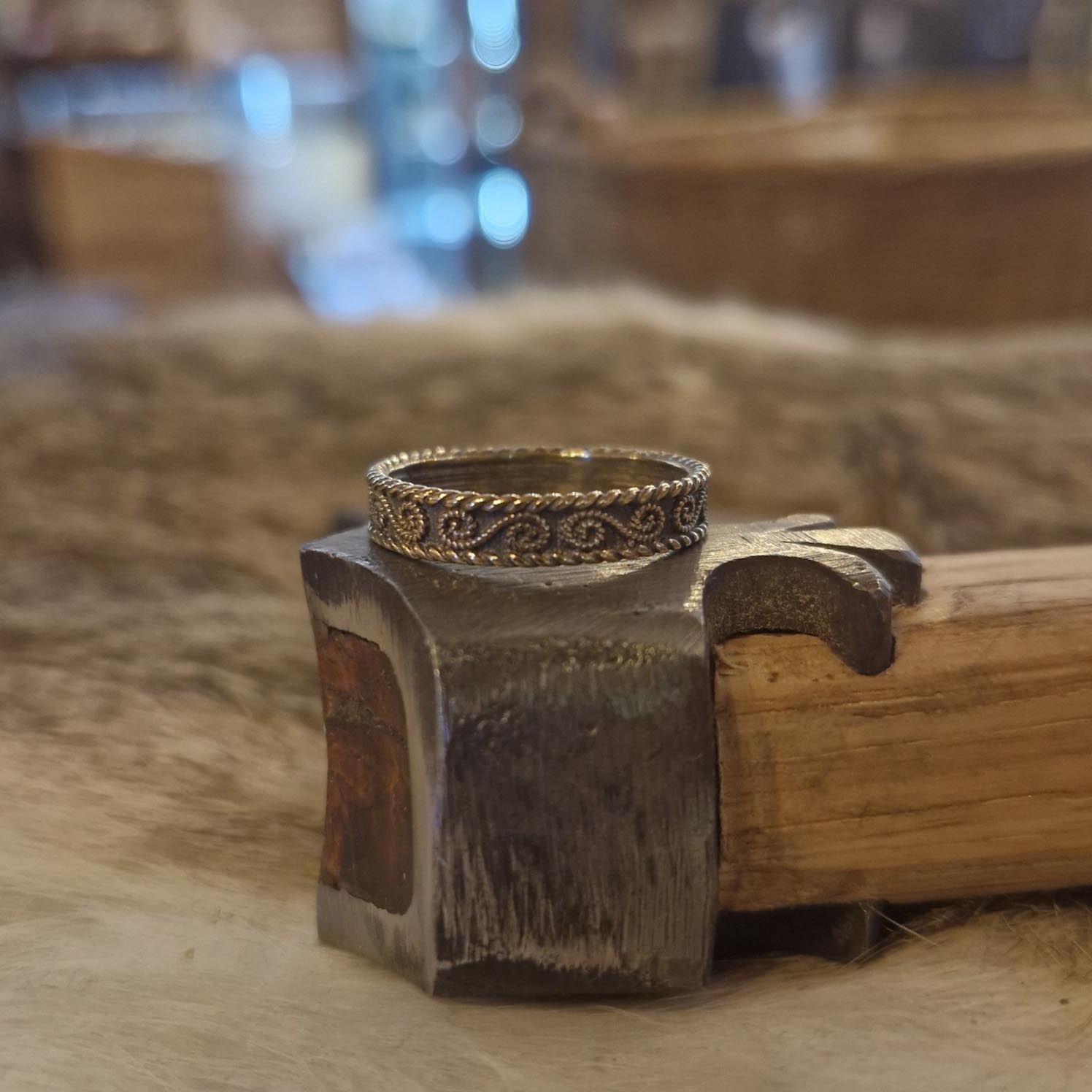 Narrow ring with bronze spirals
