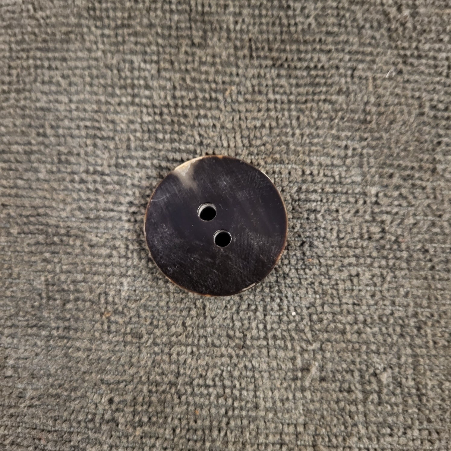 Cow horn button