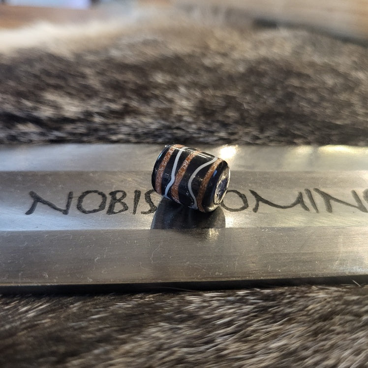 Barrel bead dark blue with orange/white thread pattern